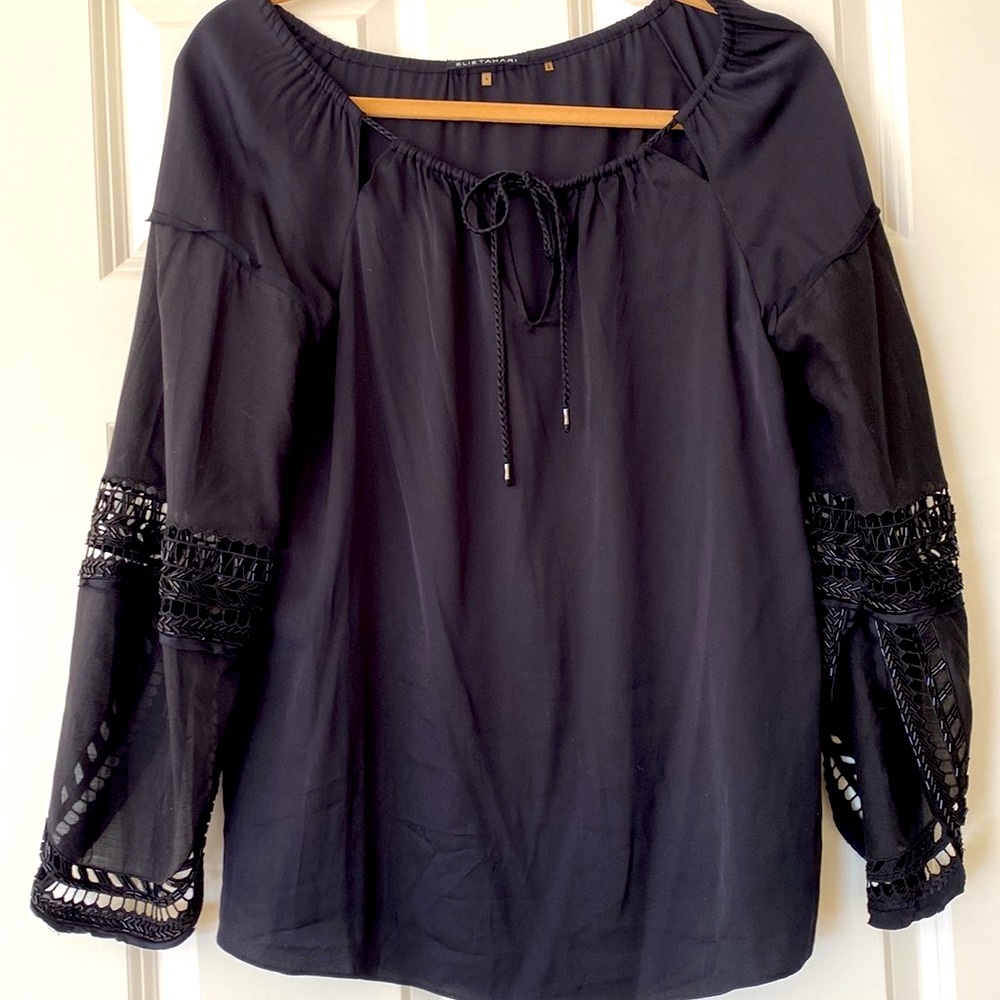 Elie Tahari silk top with cut out & beaded sleeves. Braided tie at neck. Size S